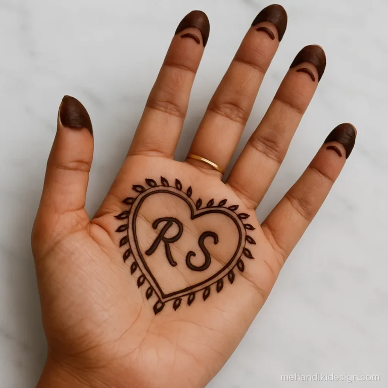 Couple name mehandi with capital letters R and S joined inside a heart on the palm