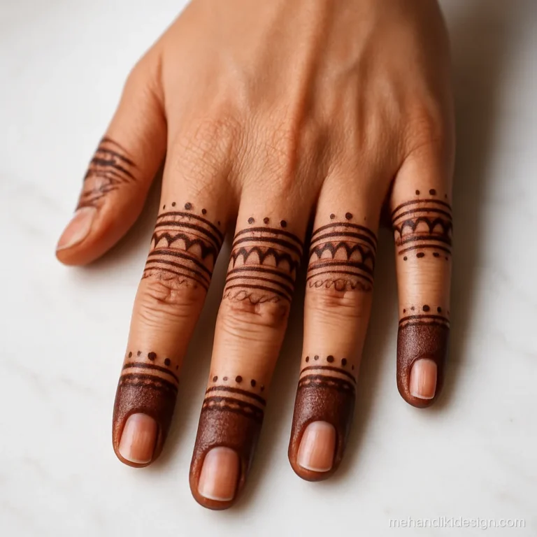 Macro photo of a dark maroon mehandi stain on fingertips and knuckles