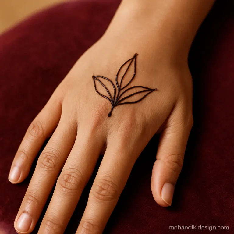 Easy mehandi designs with a three leaf cluster on the wrist