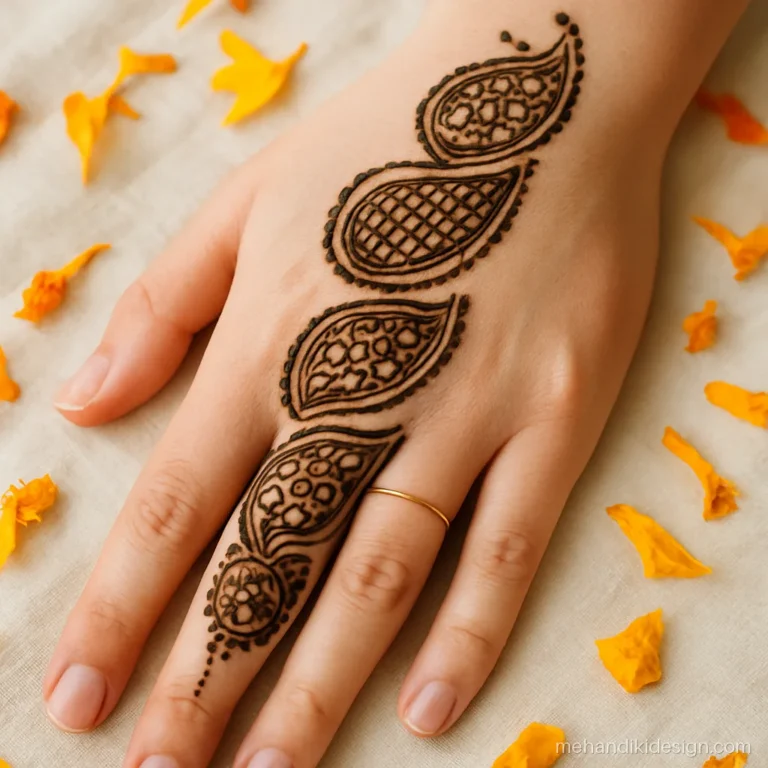 Traditional mehandi design with stacked kairi motifs from fingers to wrist