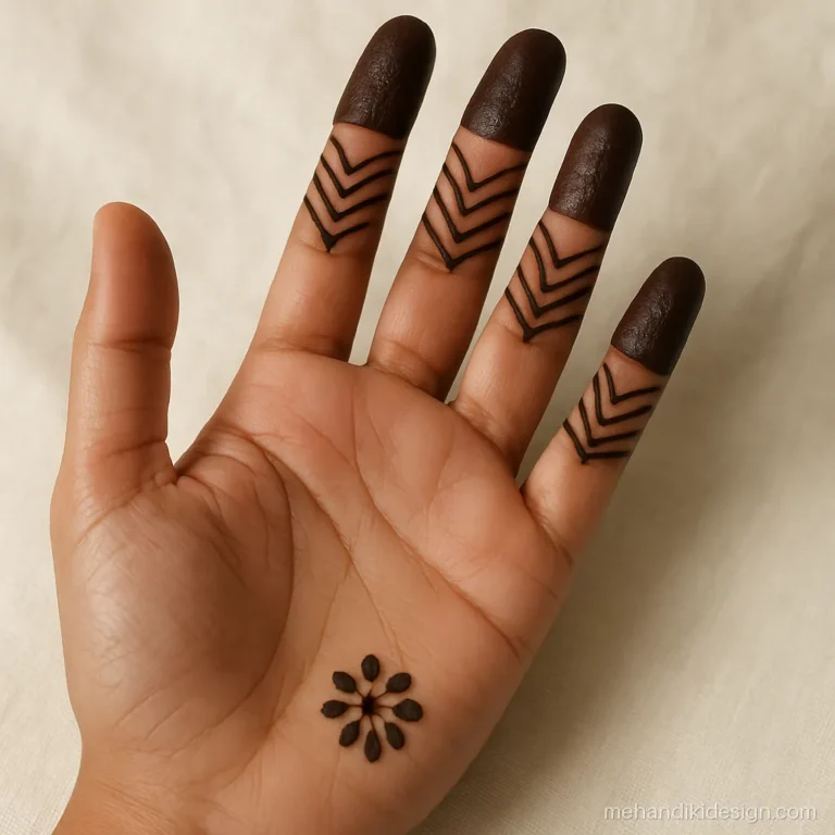 Mehandi cone design with filled finger caps and chevron lines on each finger