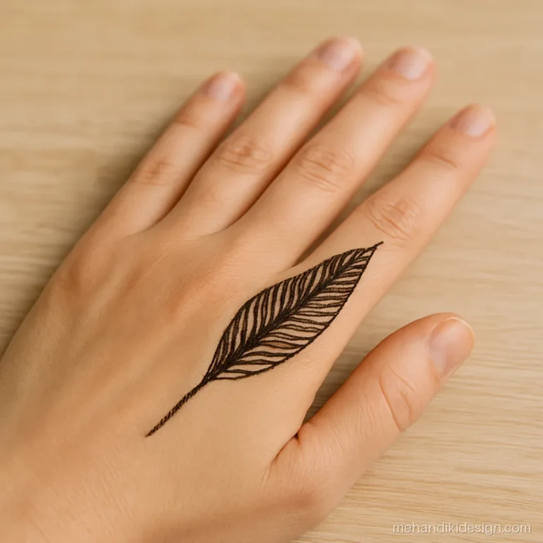 Minimal back side mehandi with a single long leaf on the hand