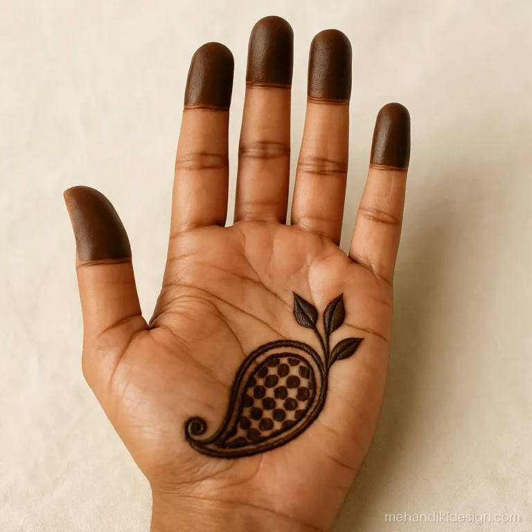 Right hand ki mehandi with a paisley in the palm corner and finger caps