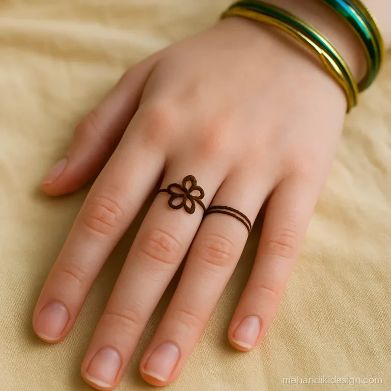 Mehandi design finger with a flower ring on the middle finger