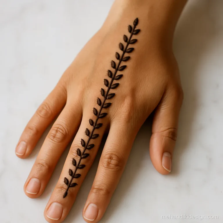 Simple bel mehandi design with alternating leaves and dots on back hand