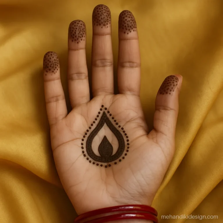 Simple Diwali mehandi with a flame shaped tikki and dotted finger tips