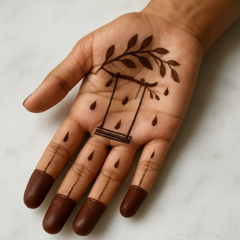 Teej mehandi design image with a swing and green leaf motifs on the palm